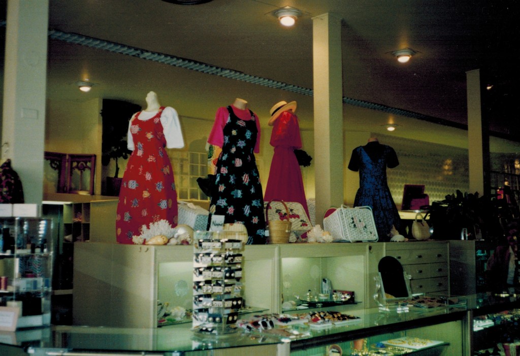 Photo of interior of Brinck's clothing store featuring clothing on mannequins. 